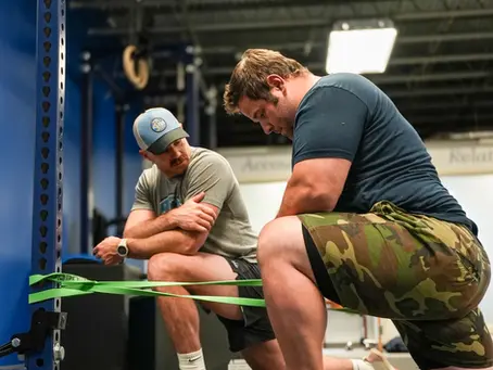 Physical therapist guiding client through new exercise program at Snow Beast Performance in Williston, VT