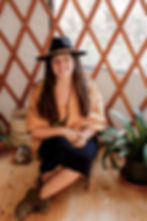 Diana Gonsalves Hansen, craniosacral therapist and Reiki Master, seated in a yurt offering nervous system care.