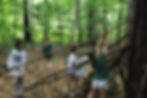 camp waukeela young campers building a fort in the forest