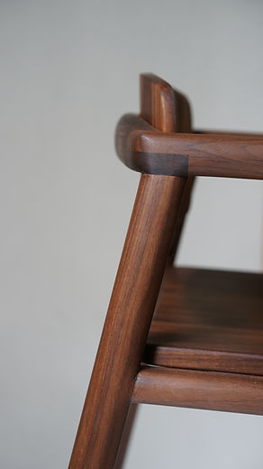Detail close up shot of the handmade American Walnut highchair.