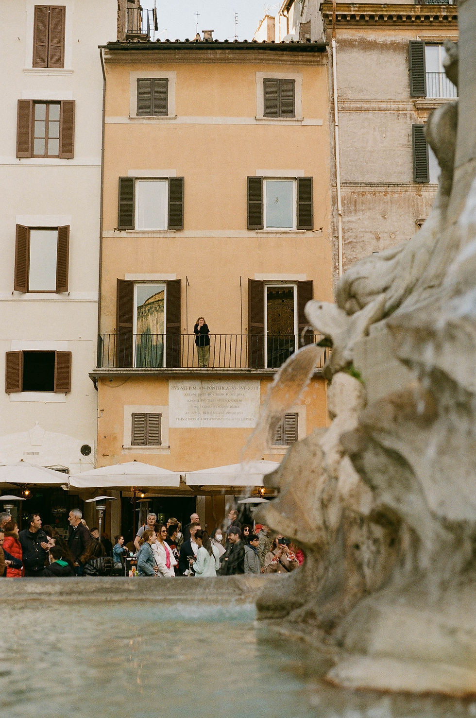Woman smoking on her balcony overlooking the Pantheon