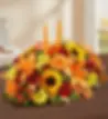 A large fall centerpiece with candles