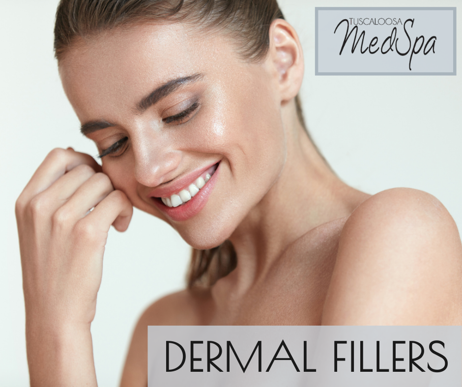 woman smiling and touching her face after having dermal fillers