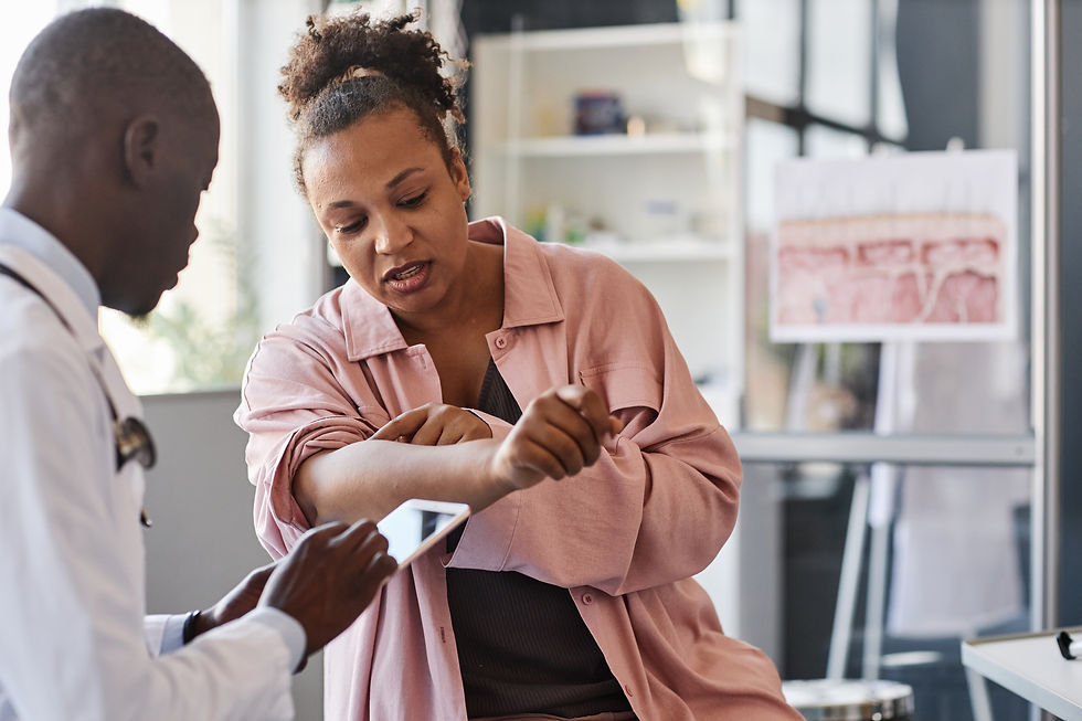 A healthcare provider examines a patient's arm for a tick bite rash at an urgent care clinic in Tuscaloosa, Alabama.