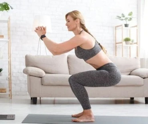 imgi_6_woman-with-fitness-tracker-crouches-and-watches-at.jpg