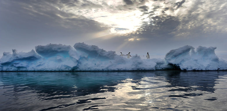 Picture below is of an Iceberg Melting from UV Radiation