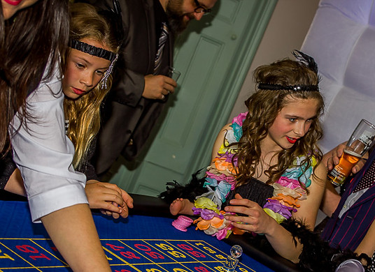 Guests playing roulette at a corporate fun casino night