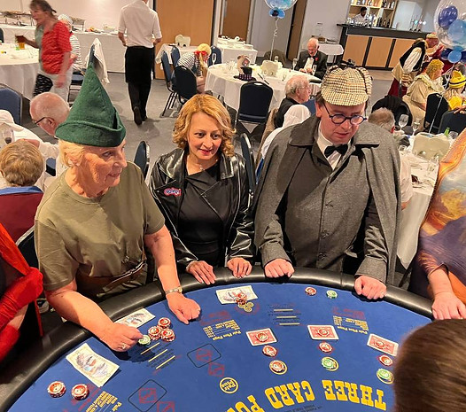 Guests playing Three Card Poker at a Midland Casino Hire event