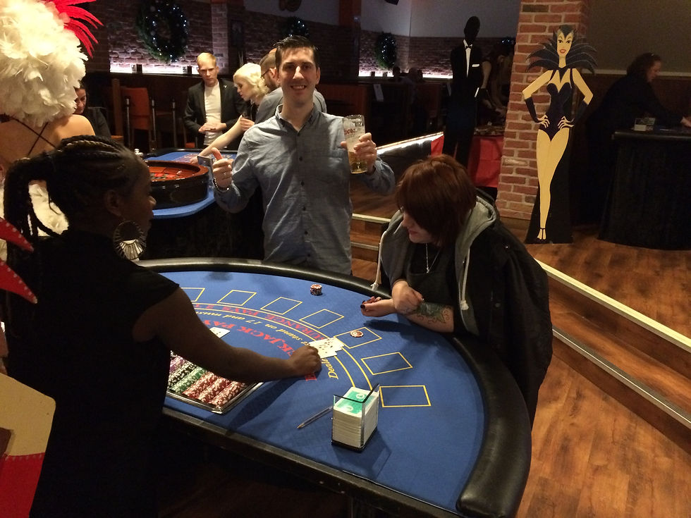 Guests enjoying roulette and blackjack at a casino hire event