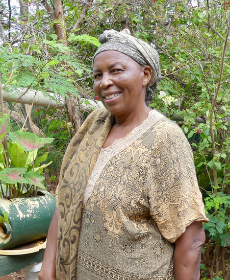 Mama Mercy, a huge advocate of preserving our environment, surrounded by trees