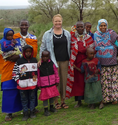 Yeyai with her daughter in law, Sarah, her grandchildren, Aida and Vics in Maasai land, Lekrumuni, Tanzania