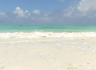 Beautiful white sandy beach and turquoise Indian Ocean waters in Zanzibar
