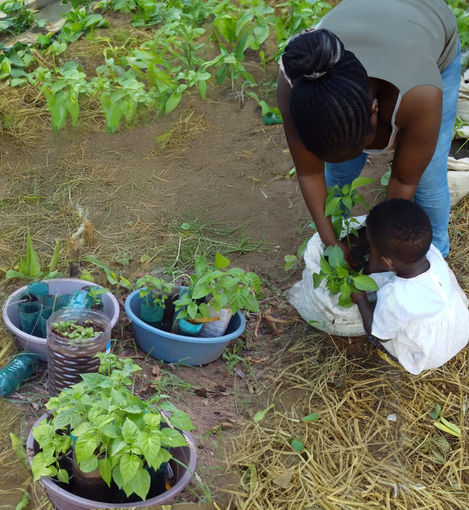 Rosie teaching young child the importance of planting trees