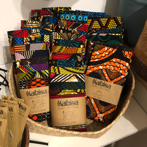 Our signature product, 100% cotton, kitenge cloth napkins displayed in a basket