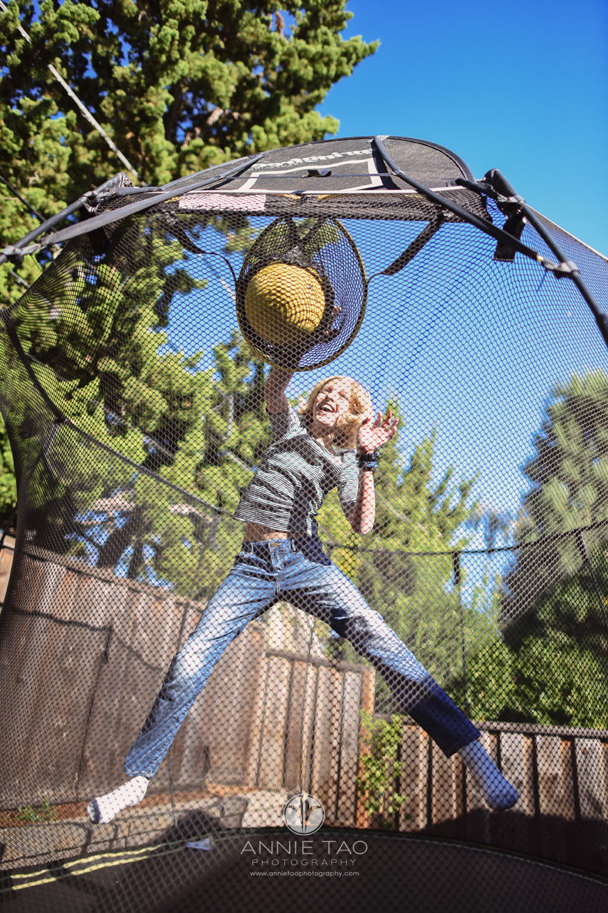 Bay-Area-lifestyle-children-photography-girl-dunking-a-basketball-on-a-trampoline-LG