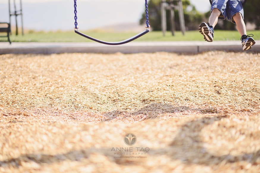East-Bay-lifestyle-children-photography-young-boy-swinging-feet-only