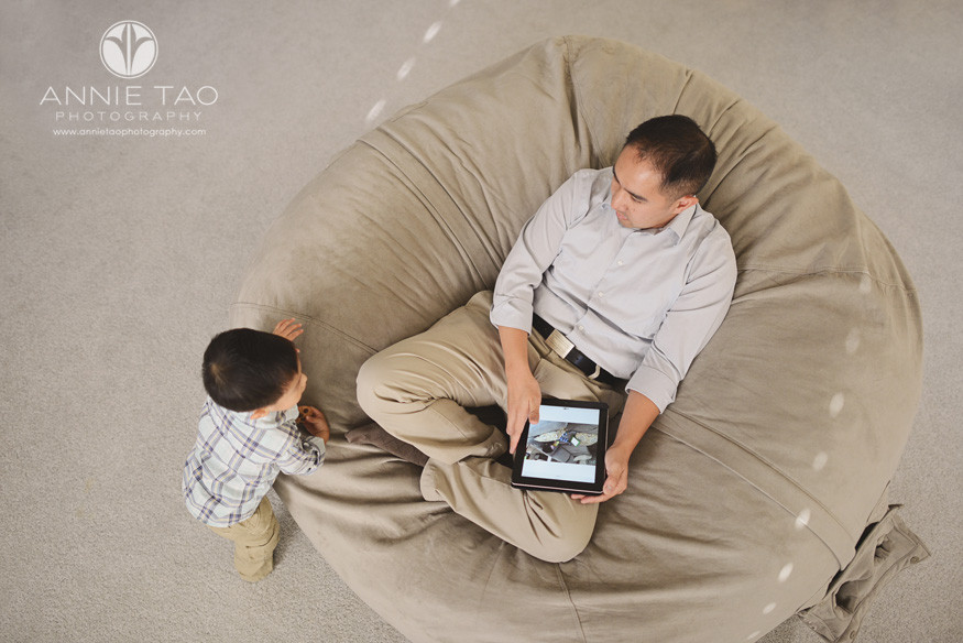 South-Bay-lifestyle-family-photography-son-next-to-father-with-iPad-in-giant-beanbag