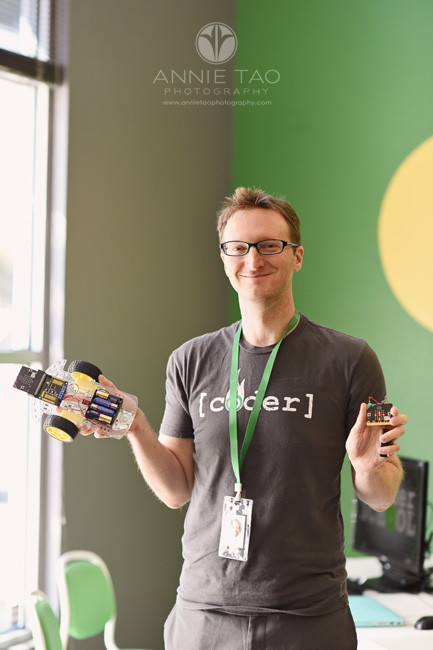 South-Bay-commercial-photography-coding-teacher-holding-robot-and-controller
