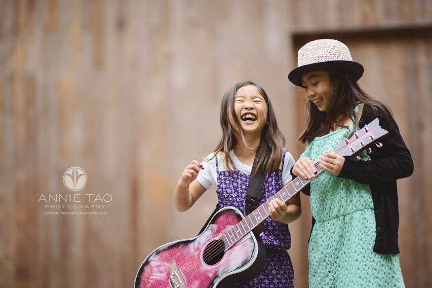 San-Francisco-lifestyle-children-photography-laughing-sisters-with-pink-guitar-2