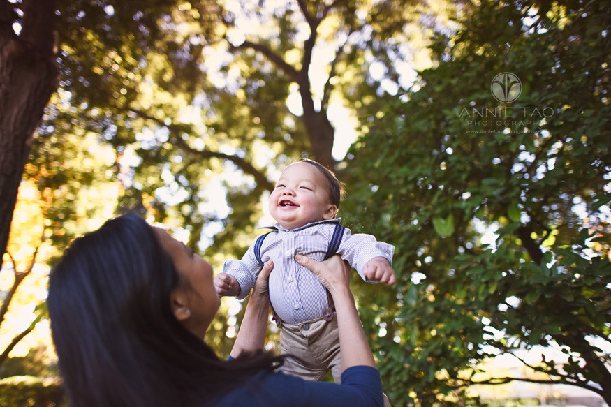 Bay-Area-lifestyle-baby-photography-baby-boy-in-suspenders-flying-in-air
