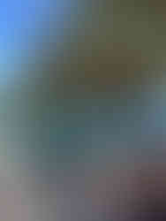 Der feinsandige Playa del Matorral bei Morro Jable mit türkisblauem Wasser und dem markanten Leuchtturm von Morro Jable