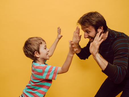 Father playing with his children