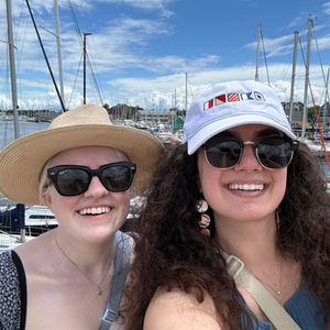 Marissa and her friend Alanna posing on a pier 