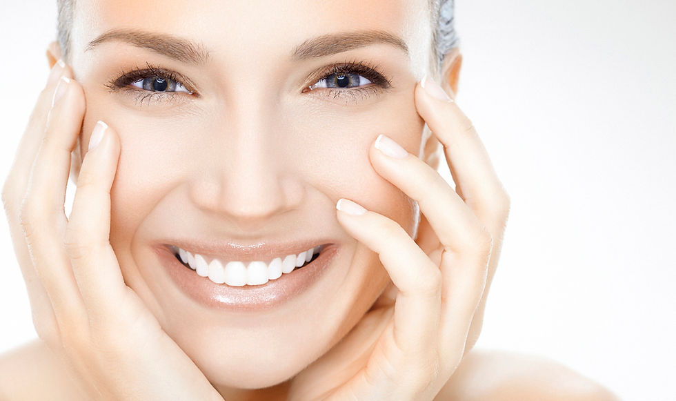 Smiling woman, hands touching her face