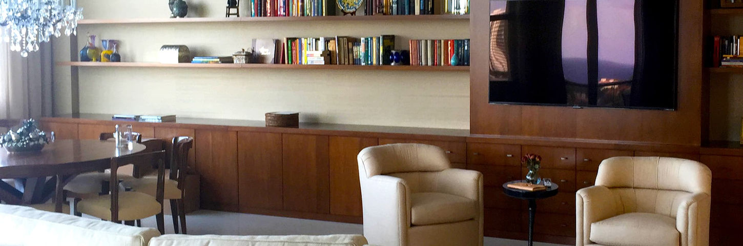 South Point Miami Beach residence living room renovation with custom carpentry, integrated lighting, and art installation.