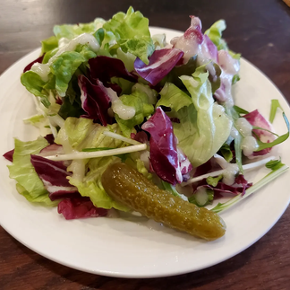 Complementary lunch salad with green and purple lettuce, pickle and dressing Margarita pizza at La Golosetta, Osaka Japan.