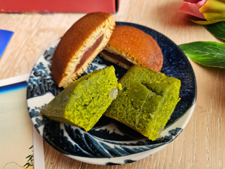 Close-up of matcha friand and strawberry dorayaki in the Sakuraco subscription box. LisaEatsTheWorld.com