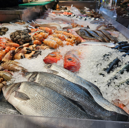 Fish monger at Torvehallerne KBH in Copenhagen Denmark. LisaEatsTheWorld.com