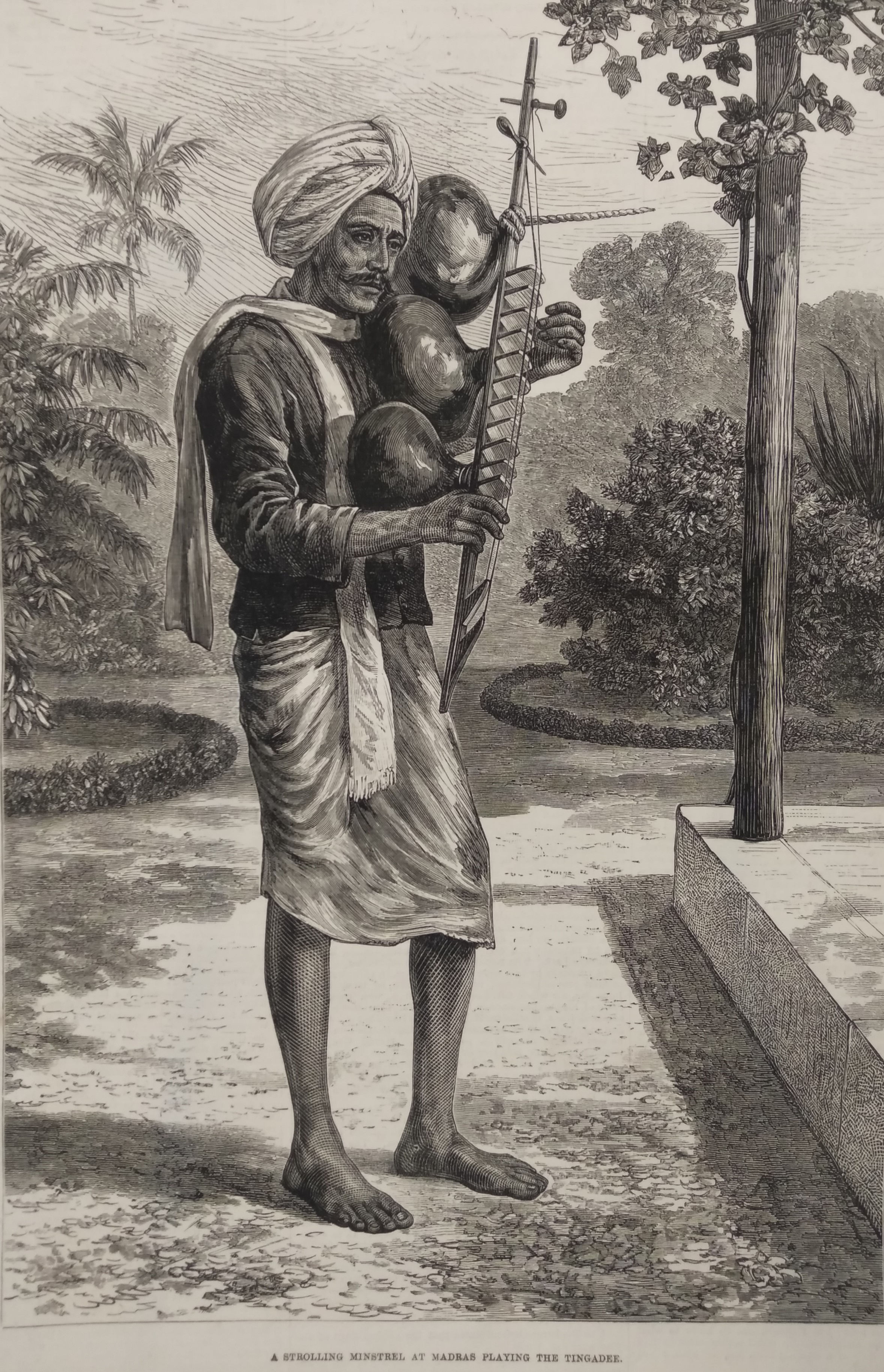 A strolling minstrel at Madras playing the tingadee 1876