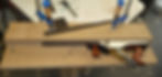 Shaping the ebony fingerboard of the neck.