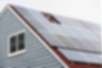 Rooftop solar panels installed on a residential home generating electricity.