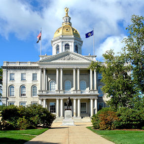 A view of the NH State House on a bright, sunny day