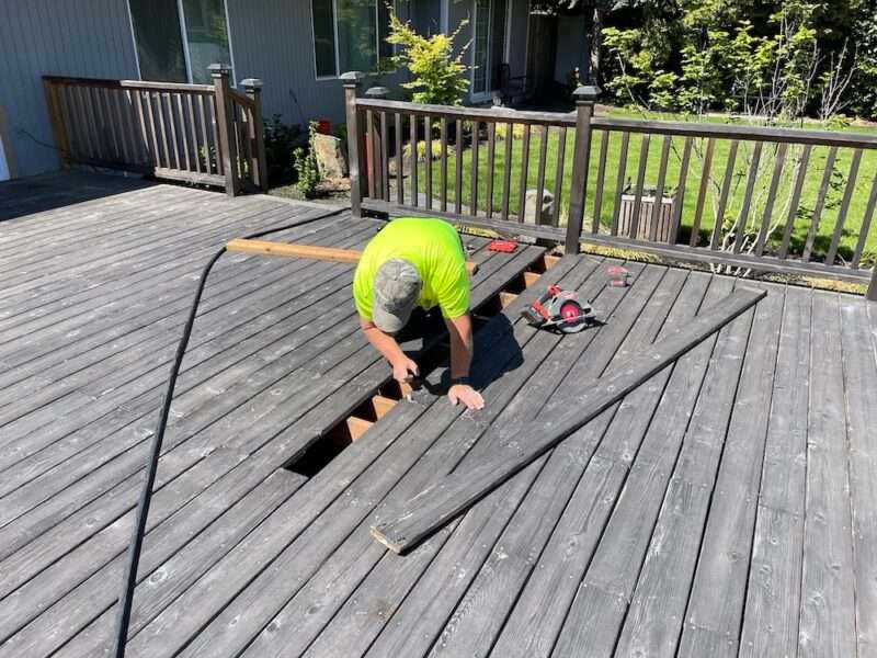 Man repairing deck
