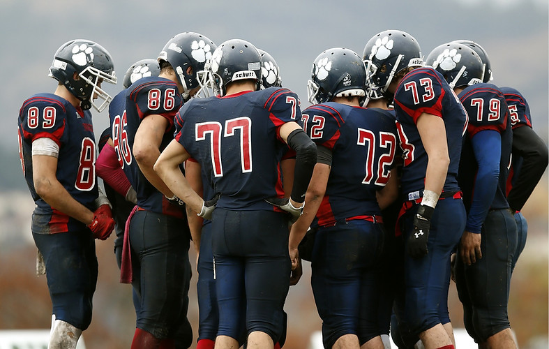 Football Player Huddle