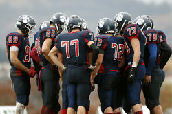 Joueur de Football Huddle