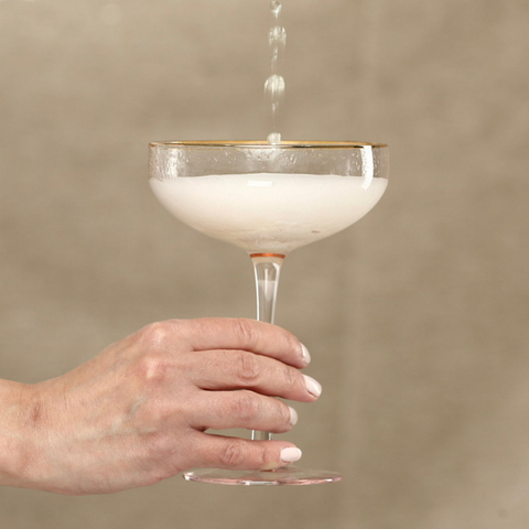 Pink champagne coupe glass.png