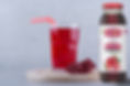 glass-pomegranate-juice-wooden-piece-with-straw.jpg