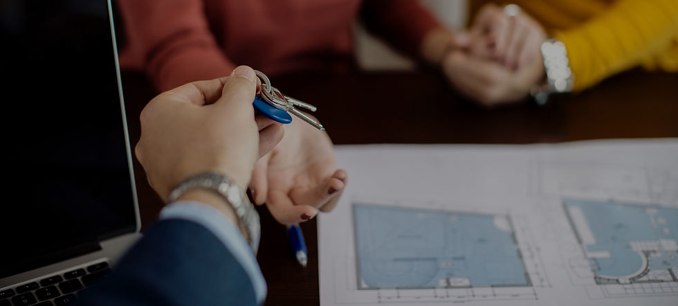 closeup-real-estate-agent-giving-couple-keys-their-new-home_edited.jpg