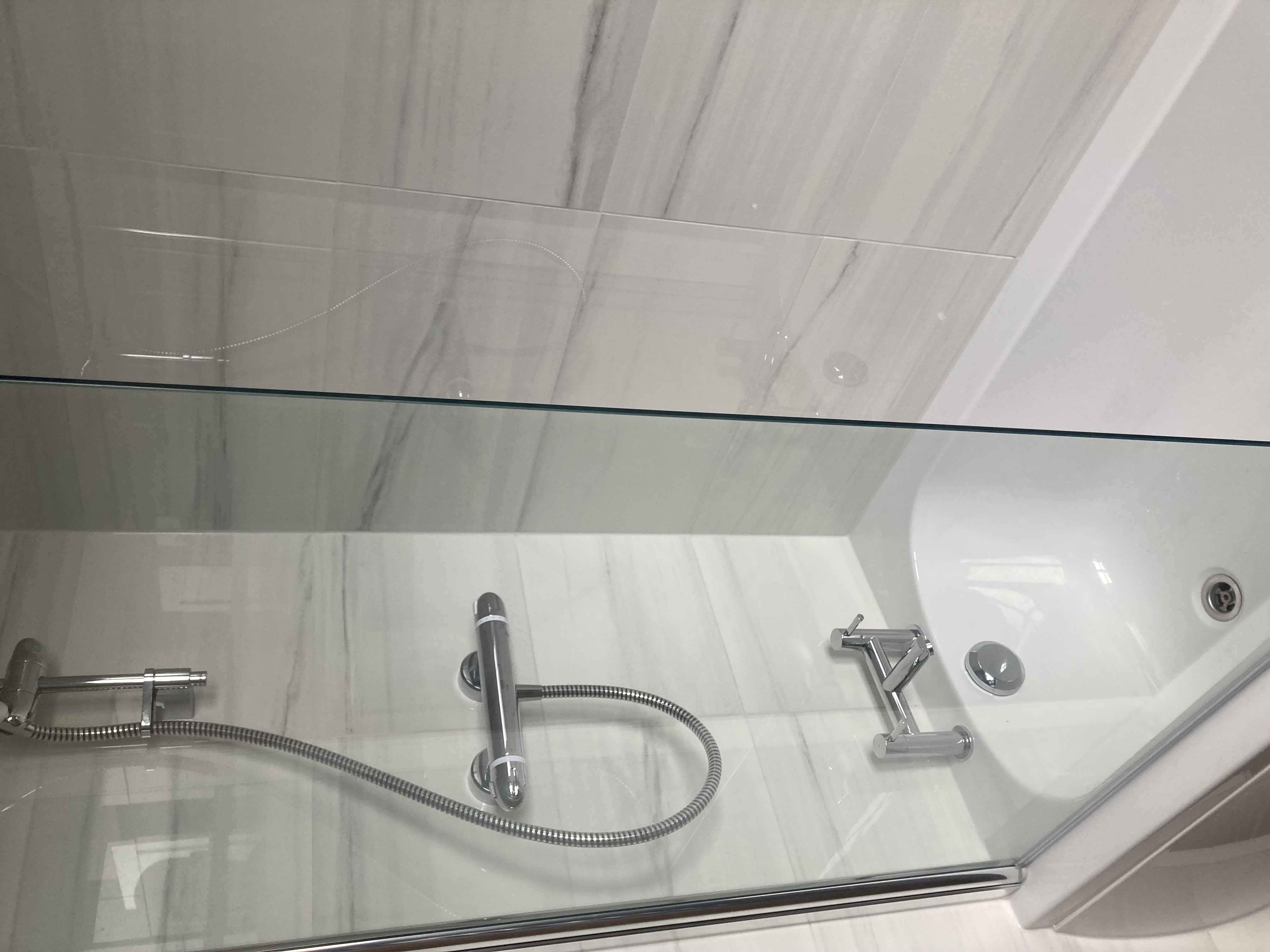 Bathroom installation — shower & bath detail