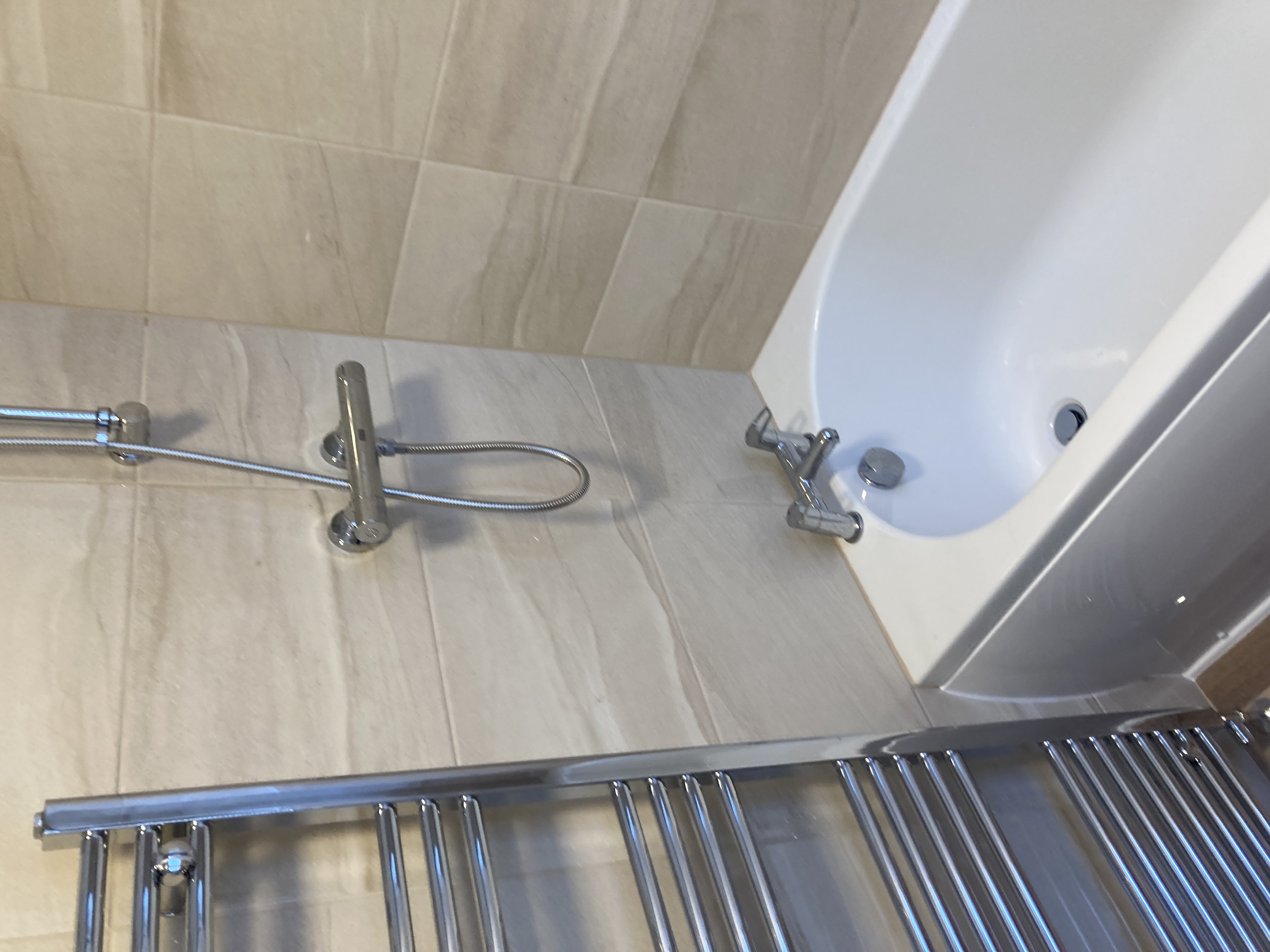 Bathroom installation — bath & towel radiator