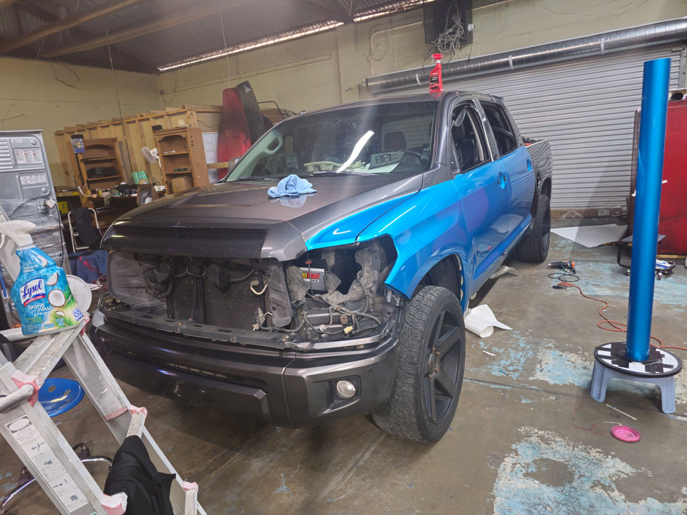 a blue truck with a sticker on the hood that says ' toyota tundra '