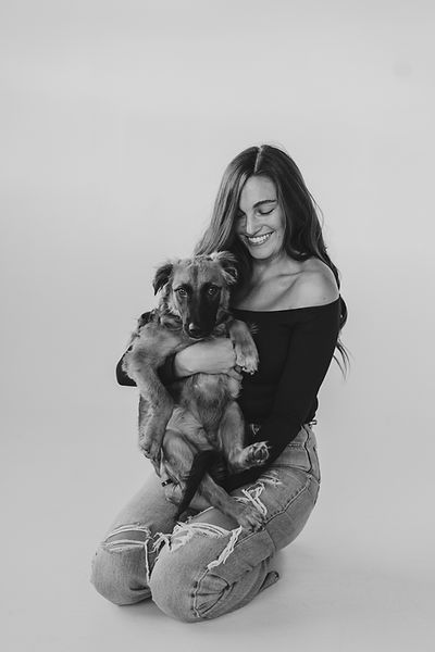 Image of photographer Jenna Loeva and her dog, Arlo in a studio session captured by Taylor Belle