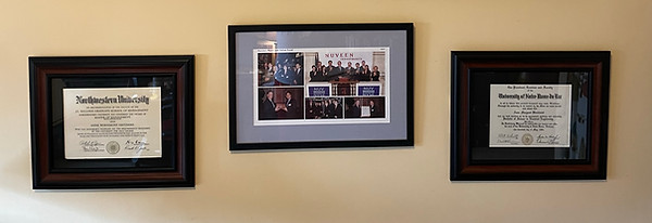 Diplomas and photos from an event at the NYSE