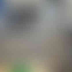 Sample part and machined valve discs in front of machine