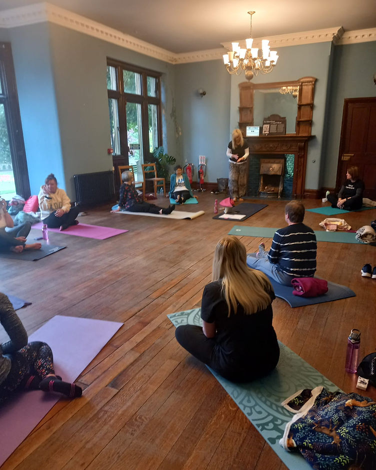 Women resting together on a day retreat in the woods