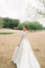 A beautiful bride walking away by a photographer based in London